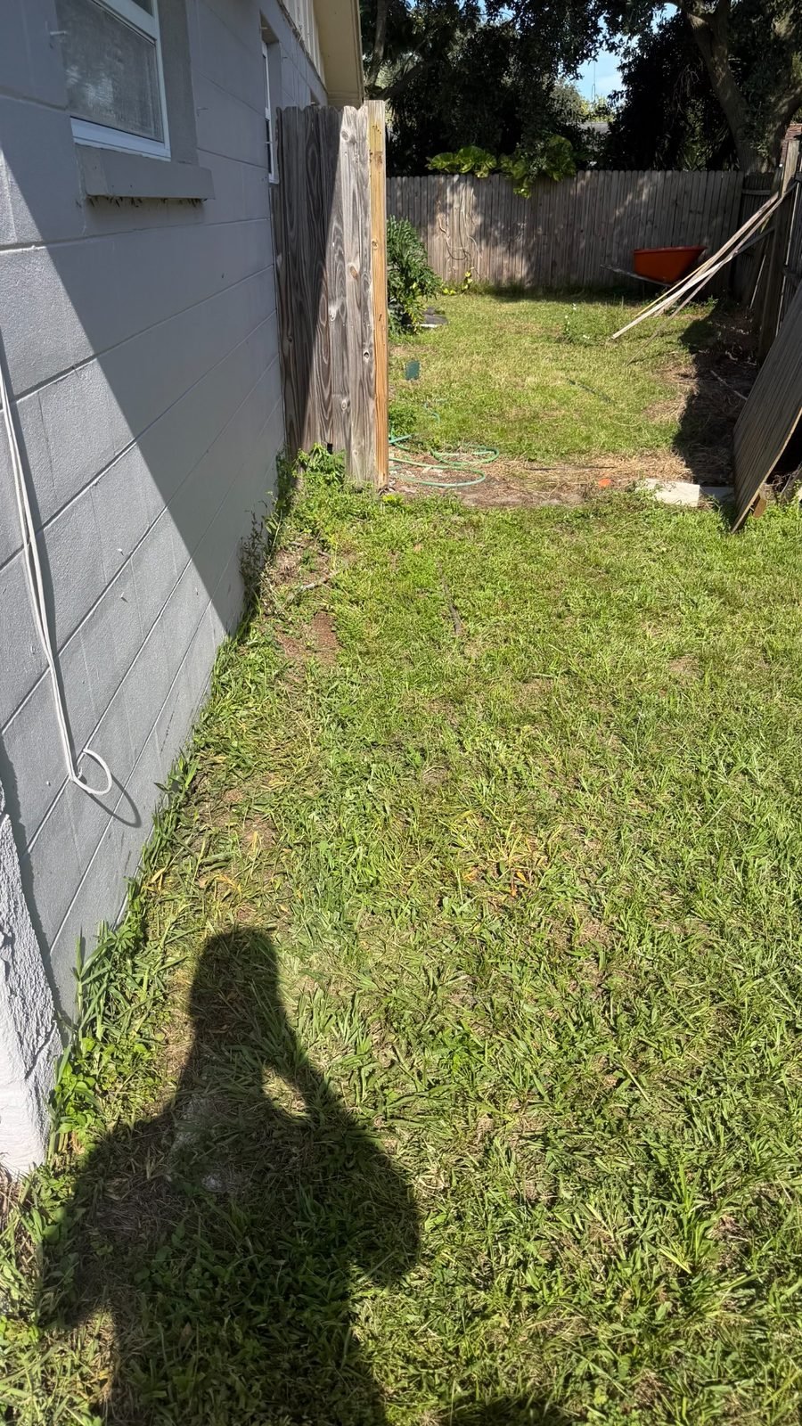 After a real residential side-yard cleanout with debris removed and access restored in Dunedin, FL 34698