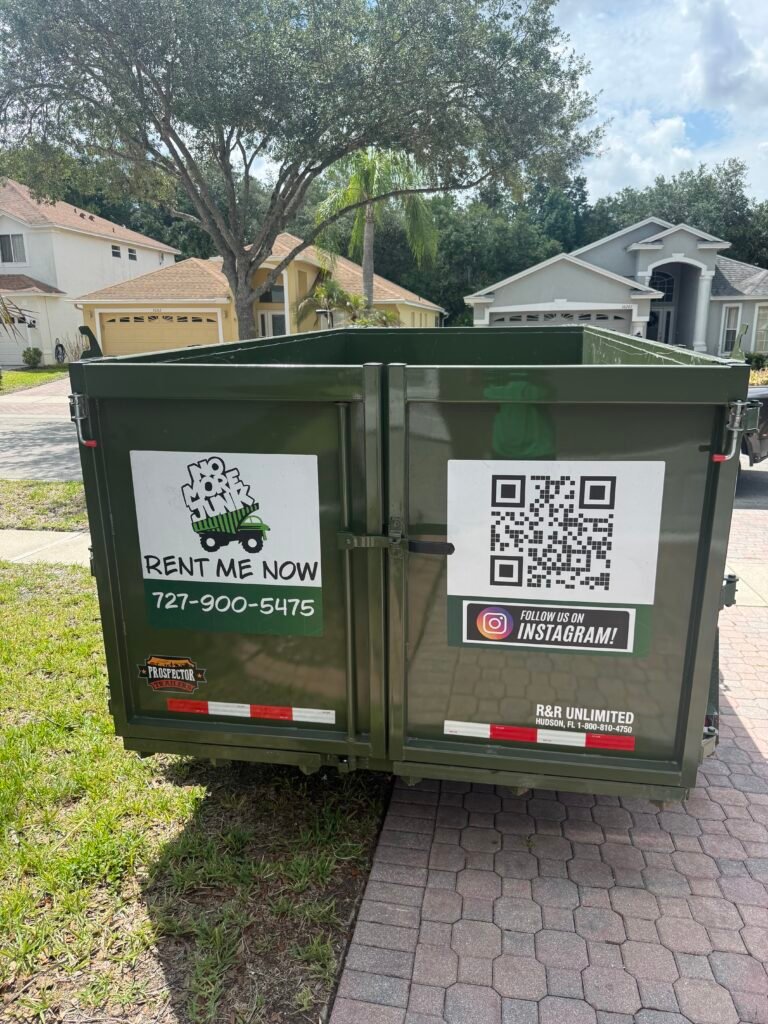 Dump trailer loaded with yard waste during a cleanup project in Tarpon Springs, Florida