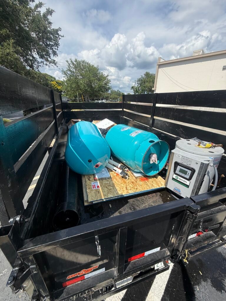 Full dump trailer loaded with household junk, furniture, and debris during a junk removal project in Palm Harbor, Florida
