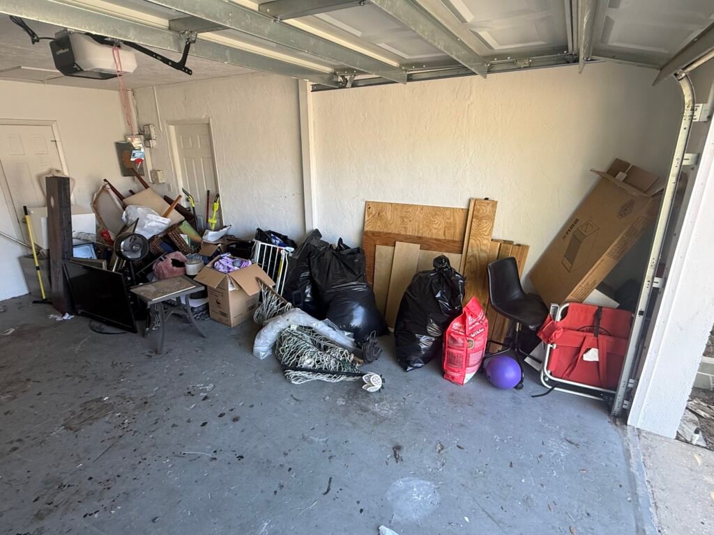 Before photo of a residential garage junk removal project in Palm Harbor, FL