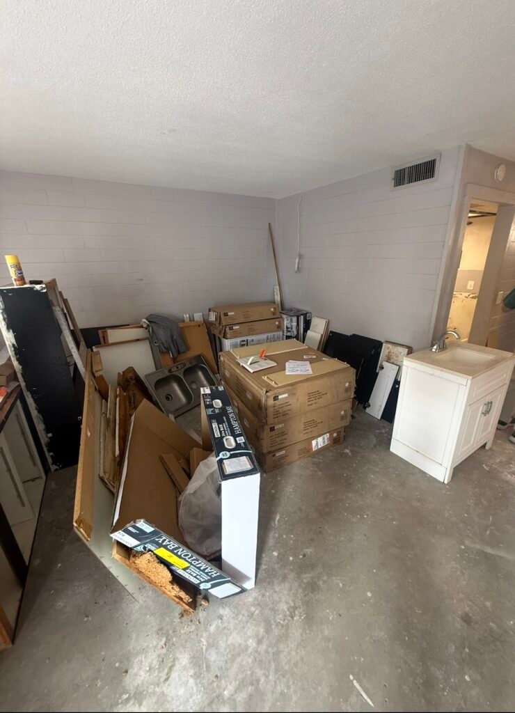 Construction debris removal project in Tarpon Springs, Florida with No More Junk hauling away renovation waste.
