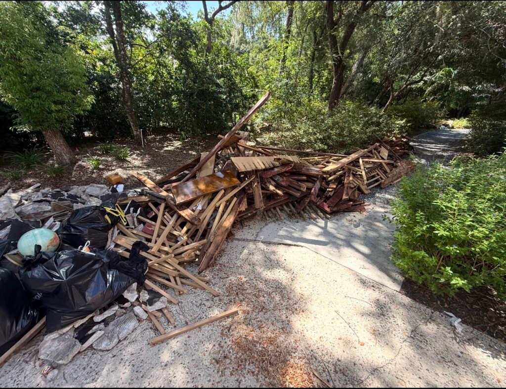 Construction debris removal completed by No More Junk in Clearwater, FL, with wood, deconstruction debris, and construction waste loaded for proper disposal.