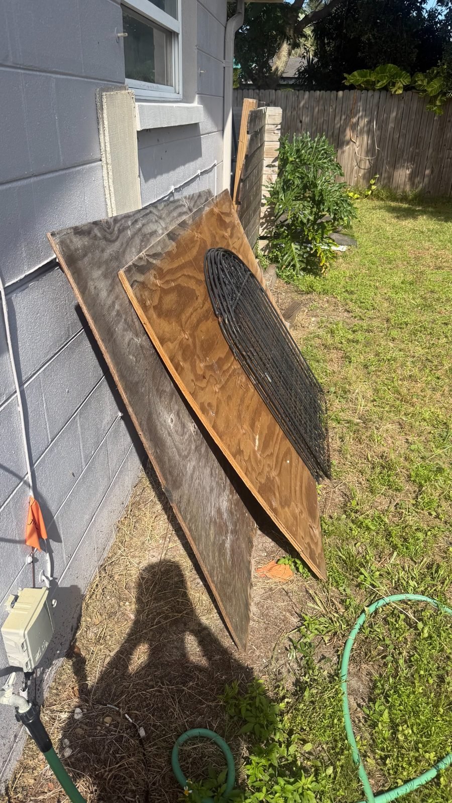 Side-yard debris before junk removal in Trinity, FL